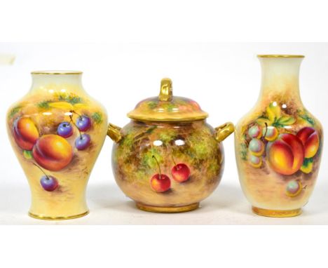 A Royal Worcester twin-handled pot and cover, painted fruit decoration by Freeman, signed, 10cm height; together with two fru