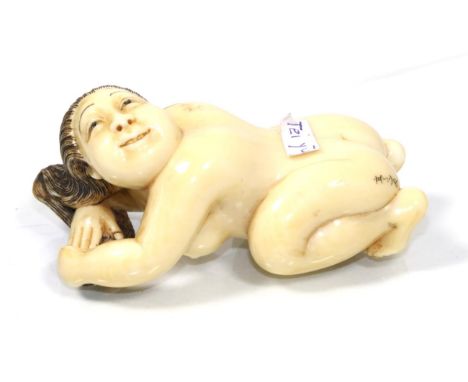 A late 19th/ early 20th century Japanese ivory erotic netsuke of a nude kneeling female, signed