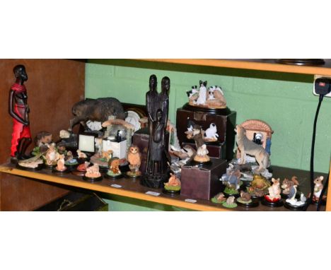 A quantity of assorted Country Artists animal figures (some boxed); a modern barometer; two carved African figures; and a buf