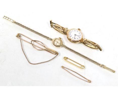 A gold cased wristwatch, a 9 carat gold cased Majex wrist watch, on a bracelet strap (a.f.), a clip stamped '9CT' and two tie