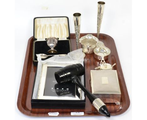 A group of silver items comprising: a pair of posy vases London 1897; a cigarette box with engine turned cover; a cased egg c
