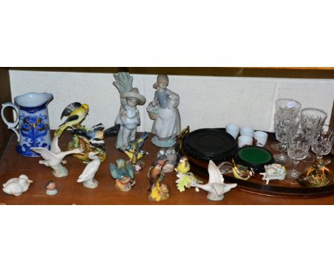 Two Lladro figures; further Lladro swans; a group of Royal Copenhagen birds; Worcester and other bird groups; an oval mahogan