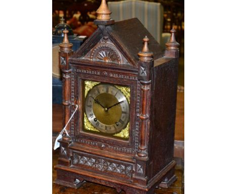An oak cased bracket clock, early 20th century, Roman dial, chiming eight day movement, architectural detail