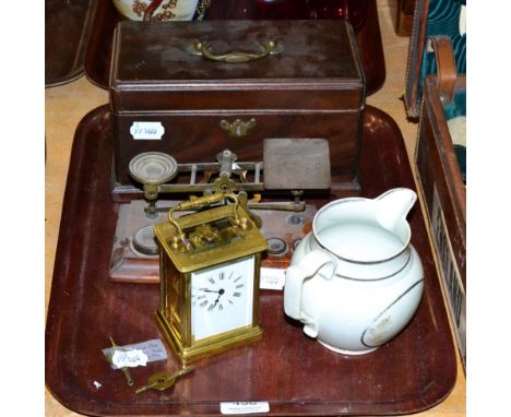 A brass carriage clock; a set of postal scales and weights; a pearlware jug; and a three section tea caddy