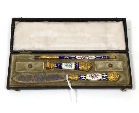 A continental gilt metal and enamel writing or desk set, probably French, 2nd half 19th century, painted with panels of flowe