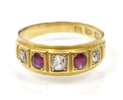 A Victorian 18 carat gold ruby and diamond ring, three graduated old cut diamonds spaced by oval cut rubies, total estimated 