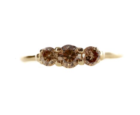 CHAMPAGNE DIAMOND THREE STONE RING, set with three graduated champagne coloured diamonds totalling approximately 0.50 carats,