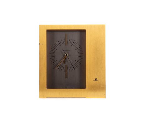 JAEGER LECOULTRE GILT METAL MANTEL CLOCK,electric powered, the grey dial with gilt baton hour markers at 12 and 6, 17.1cm hig