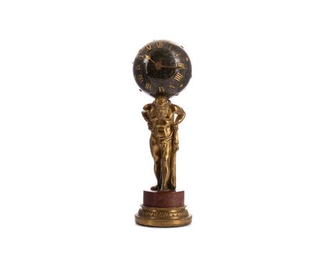 19TH CENTURY FRENCH 'ATLAS' MANTEL CLOCK,the globe of bronzed metal with applied stars and Roman numerals for dial, on gilt c