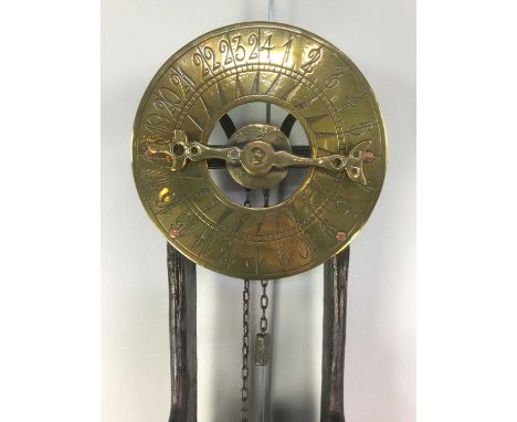 DUTCH WATER CLOCK,late 19th/early 20th century, brass on wooden frame, the circular dial set with Arabic numerals, the lower 