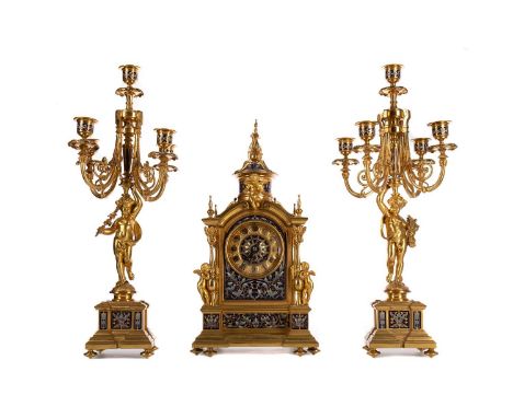 GOOD LATE 19TH CENTURY ORMOLU CLOCK GARNITURE,with foliate scroll enamelled detail, cast finials, columns and cherub mounts, 