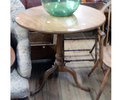 A 26 1/2" diameter 19th Century mahogany tilt-top table, set on turned pillar and tripod base with pad feet