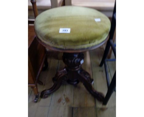 A Victorian revolving piano stool with upholstered seat, set on ornate turned pillar and acanthus scroll tripod base - screw 