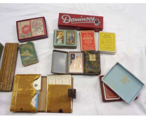 A collection of playing cards and other items including a Rhodesian deck with views of Victoria Falls, a Highgrove double set