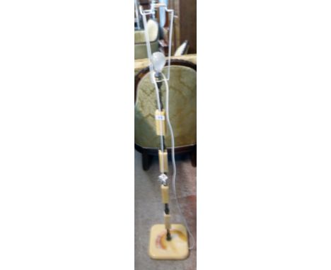 A 1980`s brassed metal and onyx effect resin standard lamp with shade