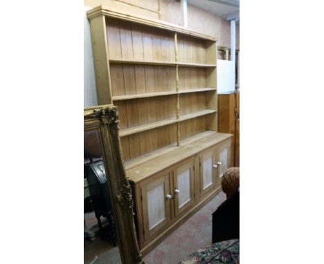 A 7' 3" old waxed pine and part painted two part dresser with central spindles to the four shelf open plate rack over a base 