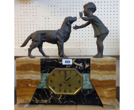 An Art Deco marble and slate cased mantel clock with cast spelter figures of a girl and dog to top with Marti gold medal eigh