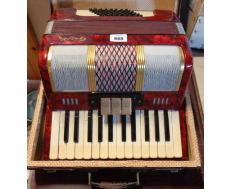 A small cased Galotta 48 button piano accordion 