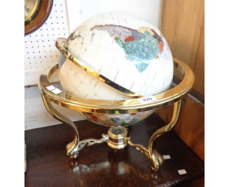 A modern stone set globe on gilt metal gimbal stand