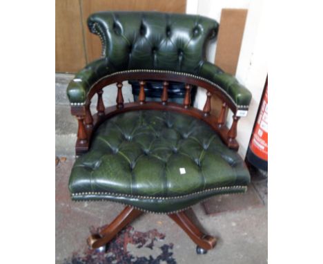 A late 20th Century stained wood and green button back leather upholstered office swivel chair with Norwegian mechanism, set 