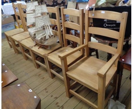A set of six late 20th Century Amish range beech framed high ladder back dining chairs with faux pegged decoration and solid 
