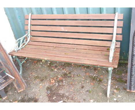 A slatted garden bench with cast metal ends
