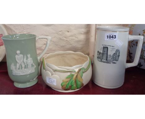 A Clarice Cliff bowl, Copeland Spode jug and a jug with monochrome decoration of the Clock Tower, Newton Abbot