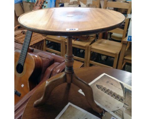 A 18" diameter reproduction mahogany pedestal wine table with mother-of-pearl disc inset top, set on turned pillar and tripod