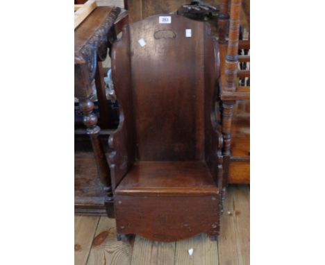 A 19th Century shepherd's style settle back child's rocking commode chair