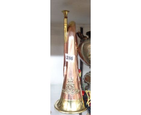 A reproduction copper and brass bugle