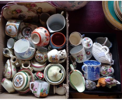 Two boxes containing miniature cups and saucers, souvenir ware, etc.