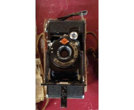 An Agfa Anastigmat F:8.8 bellows camera in leather case