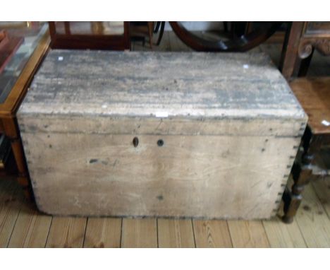 A 3' 1" old painted pine lift-top trunk with flanking iron drop handles - top split