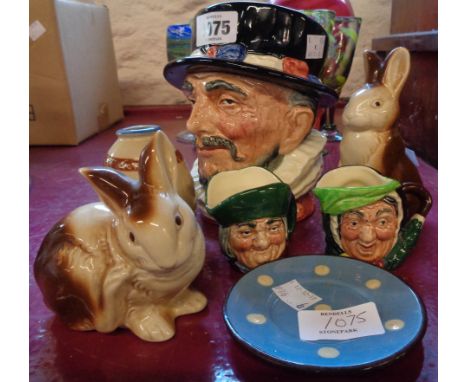Three character jugs, two Poole pottery rabbits, Motto vase, etc.