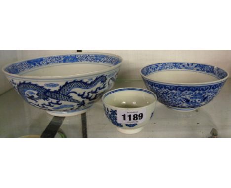 A 19th Century Chinese blue and white dragon bowl with Kangxi mark to base, a smaller similar with Xuande mark, both a/f, and