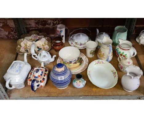 SHELF WITH VARIOUS JUGS, TEA POTS WITH CRACKED SPOUTS &amp; OTHER CHINAWARE INCL; A REGISTERED JUG WITH ROMAN CHARIOT SCENE'S