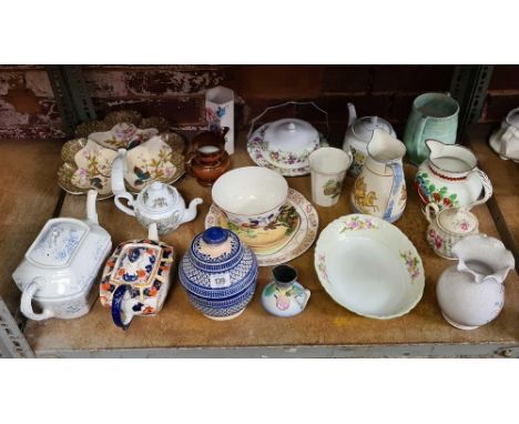 SHELF WITH VARIOUS JUGS, TEA POTS WITH CRACKED SPOUTS &amp; OTHER CHINAWARE INCL; A REGISTERED JUG WITH ROMAN CHARIOT SCENE'S