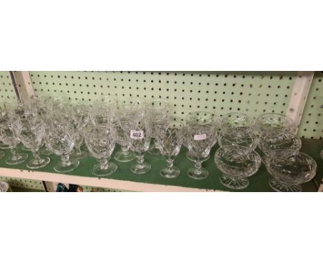 SHELF OF CUT GLASS SUNDAE DISHES, WINE GLASSES, SHERRY GLASSES, GOBLETS ETC