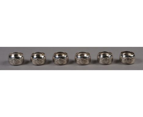 YORKSHIRE BULLDOG CLUB, A SET OF SIX ENGINE TURNED SILVER NAPKIN RINGS, each applied with a bulldog head mask, within scroll 