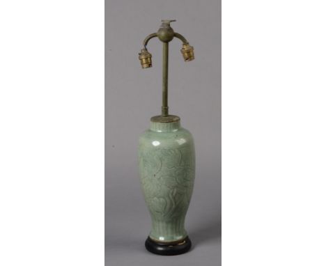 A CHINESE CELADON OVOID VASE, probably Ming Dynasty, conical with flowering peonies, reduced and fitted as a lamp, the porcel