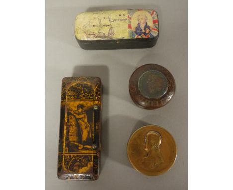 A COMMEMORATIVE PAPIER MACHE SNUFF BOX 'HMS VICTORY', 8.7cm, another decorated in gilding with Napoleon, 10cm, a brass box wi