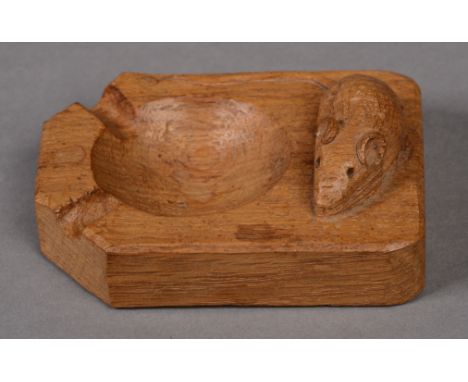 A ROBERT THOMPSON OF KILBURN 'MOUSEMAN' OAK ASHTRAY, of canted rectangular form with large carved mouse signature, the base i