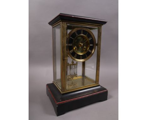 A LATE 19TH CENTURY FRENCH BRASS AND BLACK MARBLE FOUR GLASS MANTEL CLOCK, with black circular chapter ring, Roman numerals, 