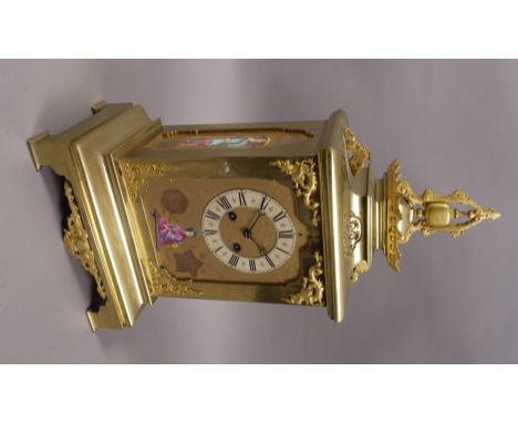 A 19TH CENTURY FRENCH GILT BRASS CHINOISERIE MANTEL CLOCK, with stylised pagoda case with two train movement, the panels deco