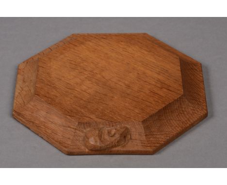 A ROBERT THOMPSON OF KILBURN 'MOUSEMAN' OAK SMALL CHEESEBOARD, of octagonal form with carved mouse signature, 21cm diameter. 