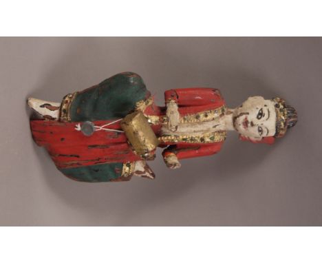 A 19TH CENTURY INDIAN PAINTED AND GILTWOOD FIGURE, of a musician playing a drum, with jewelled trimmed coat, 26cm high