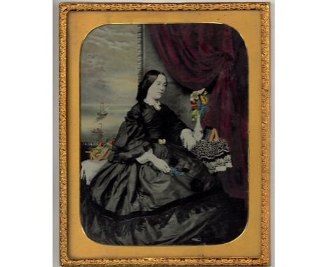 Daguerreotype and Ambrotypes, Four Portraits, a good hand-coloured half-plate ambrotype of a young lady, in red morocco case,