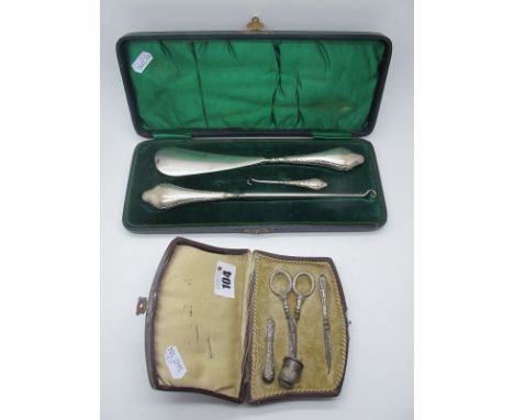 A Hallmarked Silver Handled Shoe Horn and Matching Button Hooks, Chester 1906, in original green lined fitted case; Together 