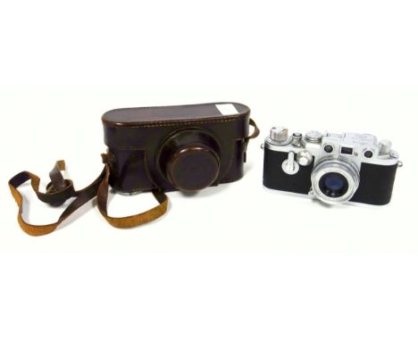 A Leitz Wetzlar Leica III camera body serial No. 829807 with Leitz Elmar f=5 cm lens serial No. 1540959 in original leather o