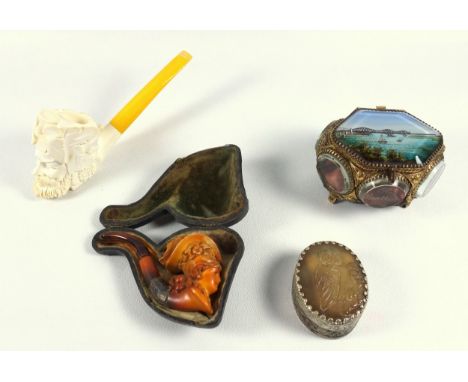 A Vintage stained Meerchaum pipe depicting a lady wearing a hat, amber mouthpiece in original case, together with a modern cl
